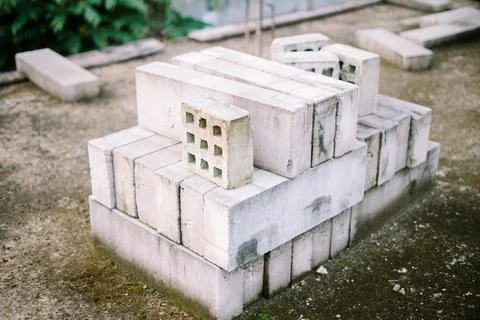 "A stack of AAC blocks stored on top of a half-finished building, showcasin.. Stock Photos