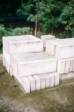 "A stack of AAC blocks stored on top of a half-finished building, showcasin.. Stock Photos