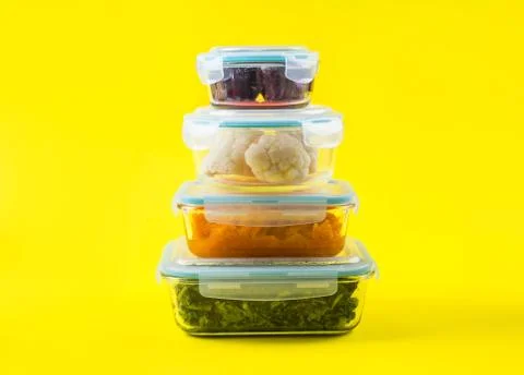 Stack of airtight glass containers with cooked food Stock Photos