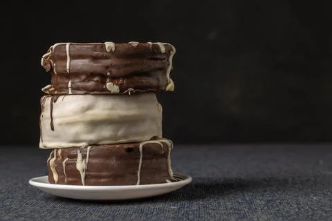 Stack of alfajores on a plate with copy space. Typical Argentinian candy. Stock Photos