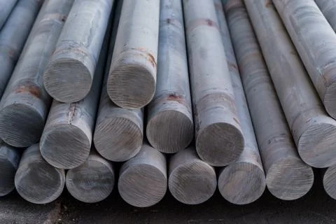 Stack of aluminium billets. Heap of aluminium bar in aluminum profiles factory Stock Photos