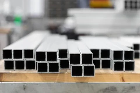 A stack of aluminum structural profiles 스톡 사진