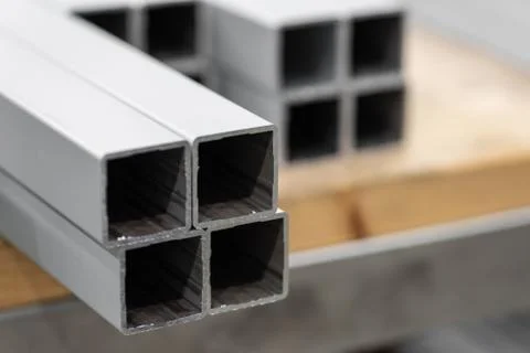 A stack of aluminum structural profiles Stock Photos