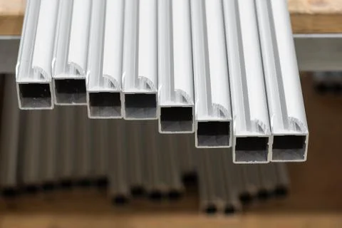 A stack of aluminum structural profiles Stock Photos