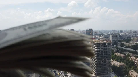 Stack of american dollars on urban background. A lot of American dollars on t Stock Footage 111160570