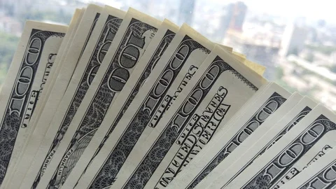 Stack of american dollars on urban background. A lot of American dollars on t Stock Footage 111161053