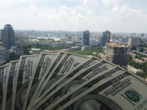 Stack of american dollars on urban background. A lot of American dollars on t Foto stock