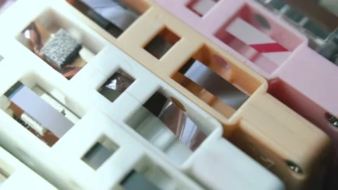 Stack of analogue magnetic audio tape, group of colorful cassettes Stock Footage 130882005