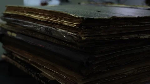 Stack of ancient books with yellow pages and shabby covers Stock Footage 177962667