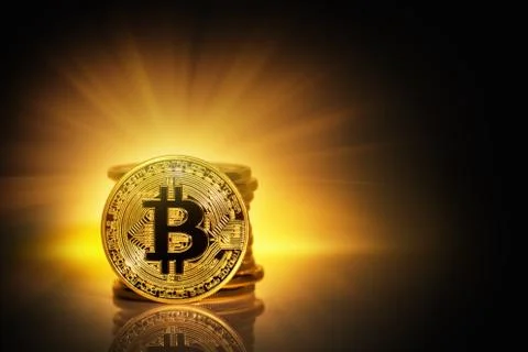 Stack and front side bitcoin in bright rays Stock Photos