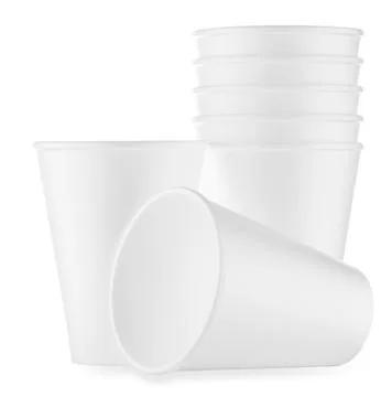 Stack and reclining white disposable glasses Foto stock