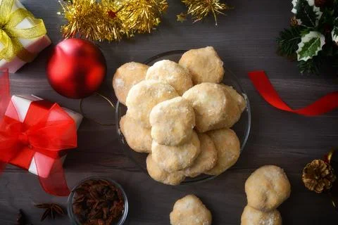 Stack of anise and sugar cookies in center on wooden 스톡 사진