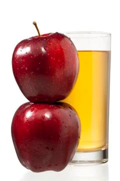 Stack of apples and juice glass Stock Photos
