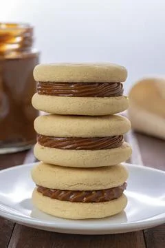 Stack of Argentinian alfajores made with cornstarch filled with dulce de lech Fotos de archivo