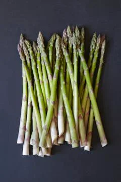 Stack of asparagus on black background Foto stock