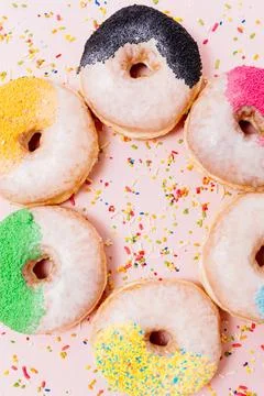  Stack of assorted donuts on a pink background Stack of assorted donuts on... Stock Photos