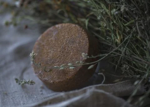 Stack of assorted natural soap bars on linen textile cloth. Pastel colors. eco Stock Photos