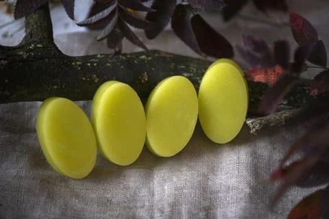 Stack of assorted natural soap bars on linen textile cloth. Pastel colors. eco Stock Photos