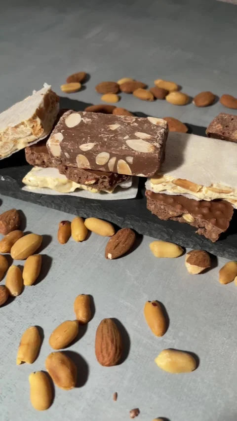 Stack of assorted nougat bars with nuts 動画素材 290015875