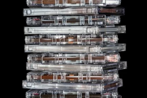 A stack of audio tape cassettes on black background. Retro vintage music co.. 스톡 사진