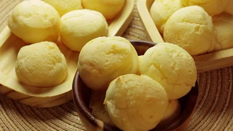 Stack of authentic Brazilian cheese bread rotating in rustic wooden bowls. Stock Footage 337273297