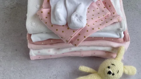 Stack of Baby bodysuits Stock Footage 272451824
