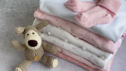 Stack of Baby bodysuits Stock Footage 272985707