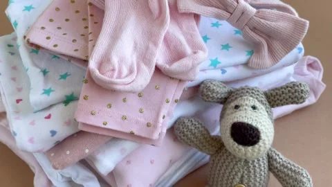 Stack of Baby bodysuits Stock Footage 273548448