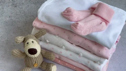 Stack of Baby bodysuits Stock Footage 273985438