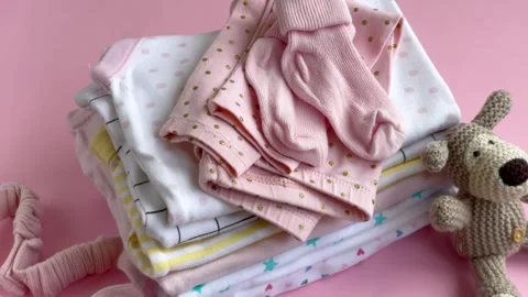 Stack of Baby bodysuits Stock Footage 273985457