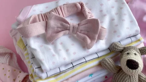 Stack of Baby bodysuits Stock Footage 274253551