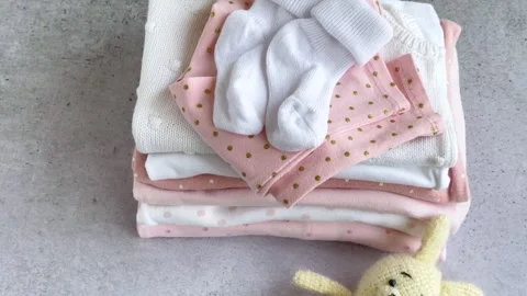 Stack of Baby bodysuits Stock Footage 274651558