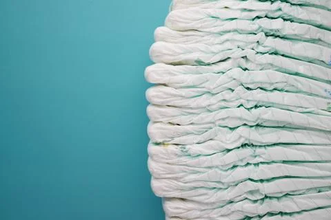 Stack of baby diaper on table with copy space Stock Photos
