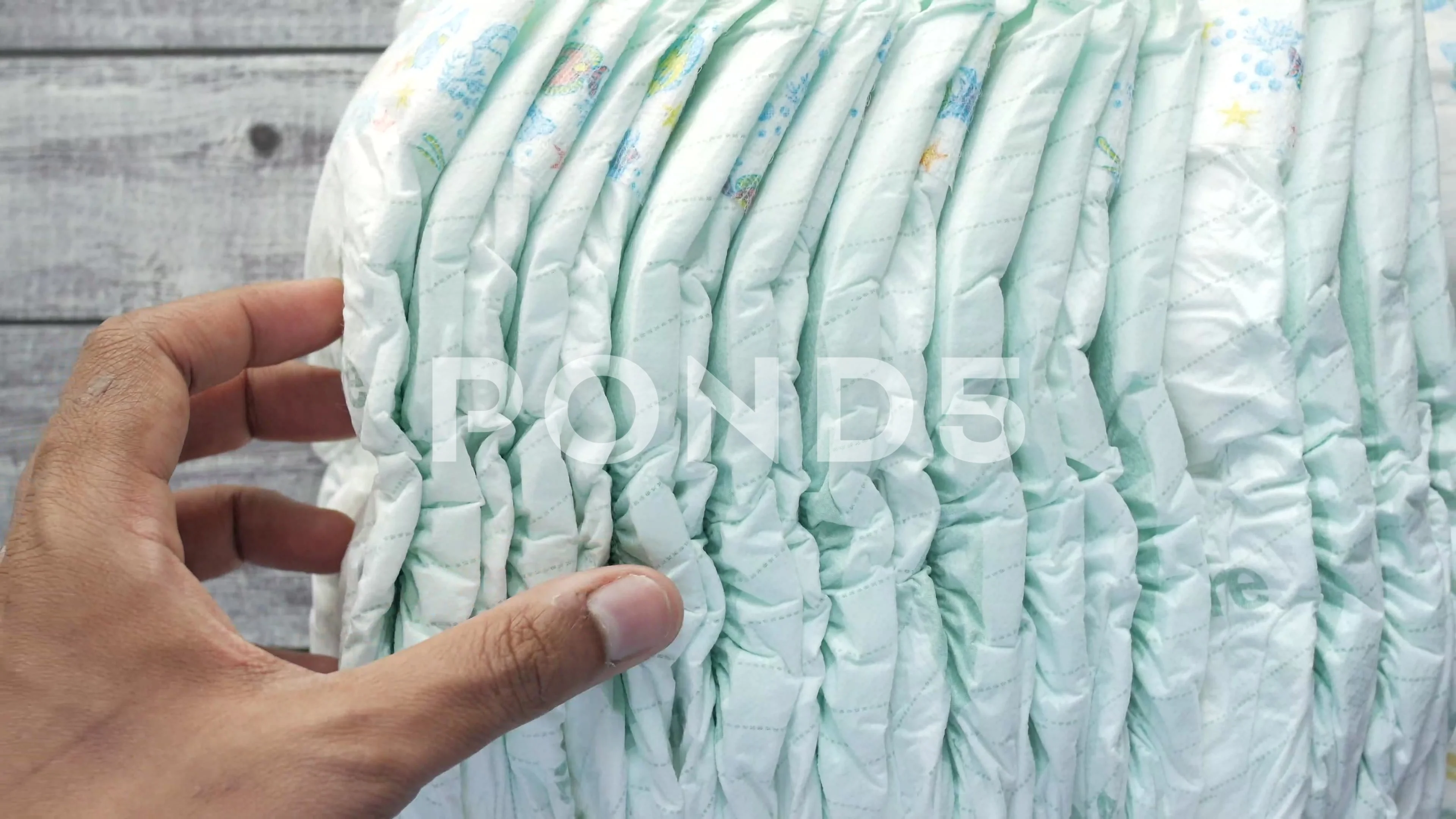 Baby diapers stacked each other on isolated background. 14537626