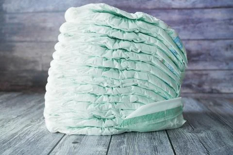 Stack of baby diaper on table, Stock Photos