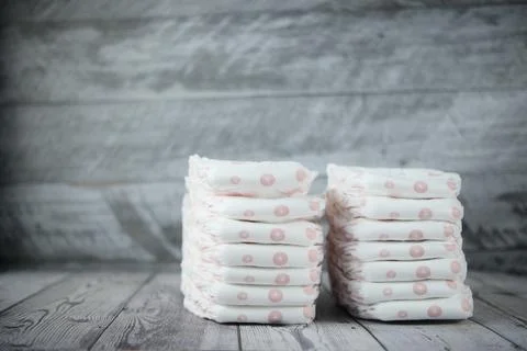 Stack of baby diaper on table, Stock Photos