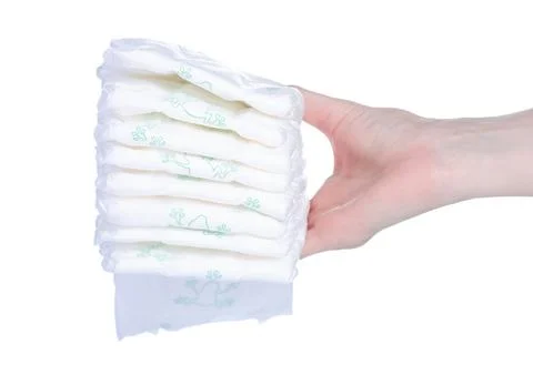 Stack baby diapers in hand Stock Photos