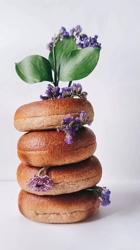 Stack of bagels with flowers Stock Footage 272997962