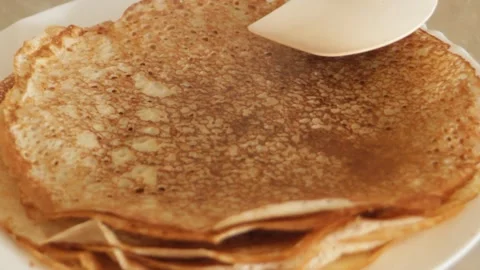 A stack of baked golden pancakes. Finished pancakes stacked on top of each other Stock Footage 304878005