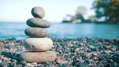 Stack Of Balanced Stones On The Beach Stock Footage 81177596