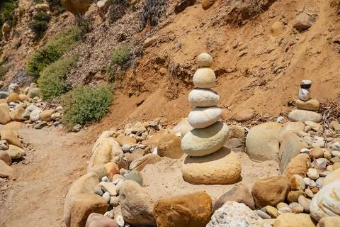 Stack of balanced stones at the beach Stock Photos