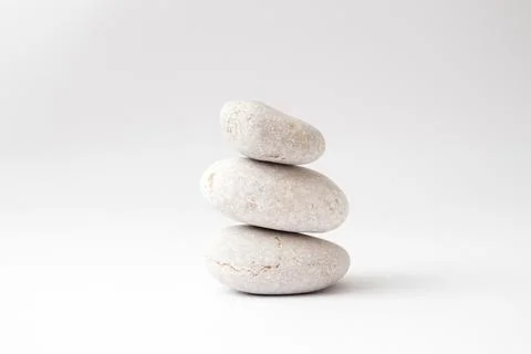 A stack of balancing stones on white background Stock Photos
