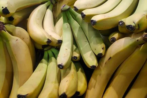 Stack of bananas on a market stall Stock Photos