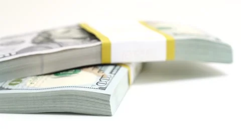 Stack of bank bundles with US dollars on a white background. Close-up shot of Stock Footage 242074307