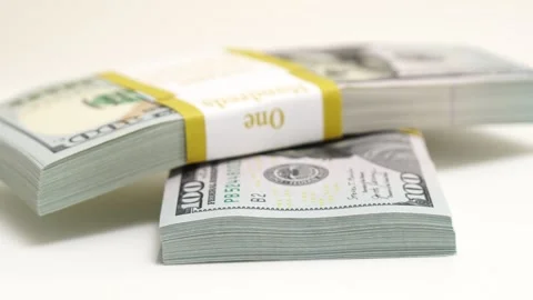 Stack of bank bundles with US dollars on a white background. Close-up shot of Stock Footage 242152169