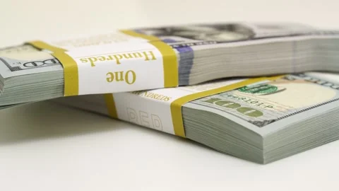 Stack of bank bundles with US dollars on a white background. Close-up shot of Stock Footage 243484345