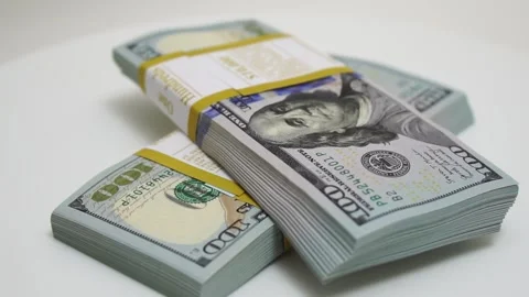 Stack of bank bundles with US dollars on a white background. Close-up shot of Stock Footage 244037775