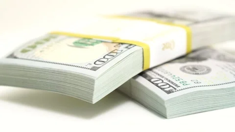 Stack of bank bundles with US dollars on a white background. Close-up shot of Stock Footage 244206260