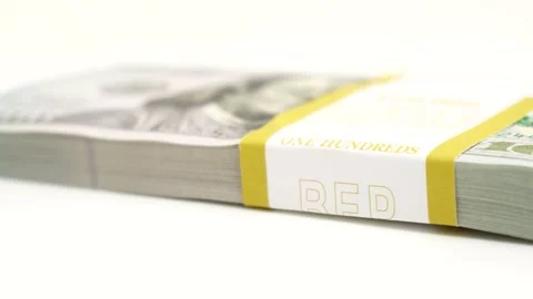 Stack of bank bundles with US dollars on a white background. Close-up shot of Stock Footage 244517212
