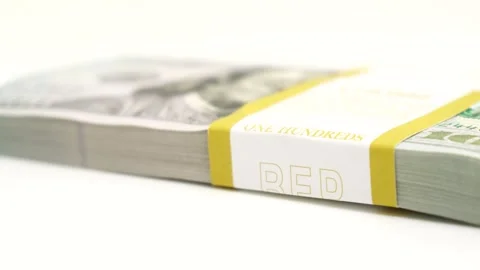 Stack of bank bundles with US dollars on a white background. Close-up shot of Stock Footage 244634525